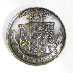 25-5.1.1 Coats of arms only (must have family shield) - achievement shield, crest (bird in a crest coronet), family motto on banner - silver-plated copper - 1 & 1/16"