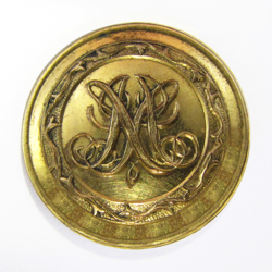 25-5.3.2 Initials, monograms (by themselves, no crest present) - Monogram of several initials with a fancy border- gilded brass  - 1"
